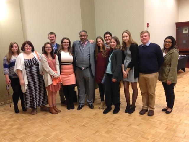 Anthony Ray Hinton and UE students pose for a picture at the reception following his presentation..